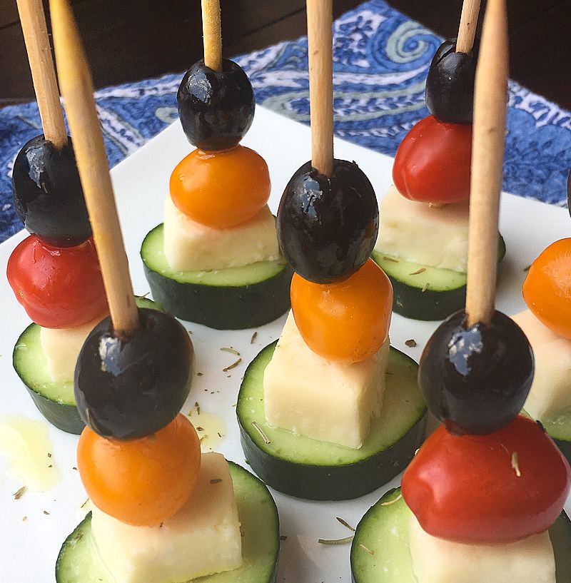 Greek salad skewers with cucumber on a plate