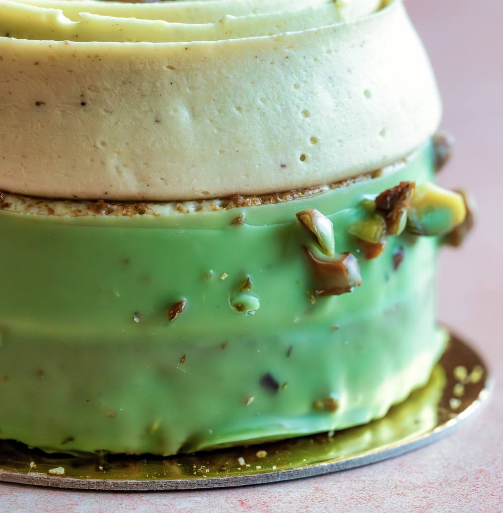 dessert with pistachio and vanilla ice cream stacked 
